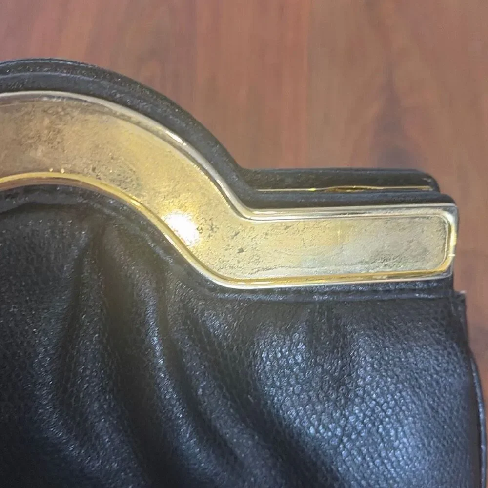 Richters Black leather vintage clutch with rhinestone detail
